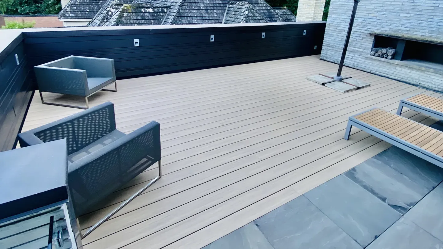 AZEK PVC rooftop deck with a fireplace, seating and black fascia