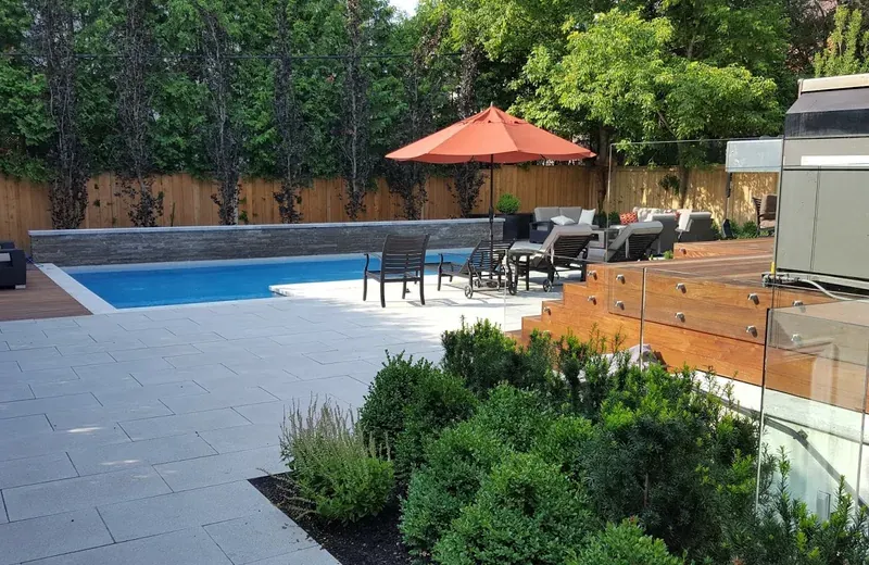 Finished Ipe hardwood deck beside a backyard pool