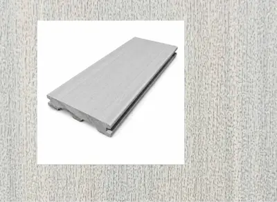 3Peaks Composite decking in Silver Oak — board close-up beside a finished deck