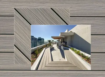 Eva-Last Infinity decking in Caribbean Coral — board close-up beside a finished deck